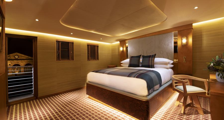 Super king size bed with under bed lighting in Fingal's Hyskeir luxury cabin room at 5 star hotel Edinburgh