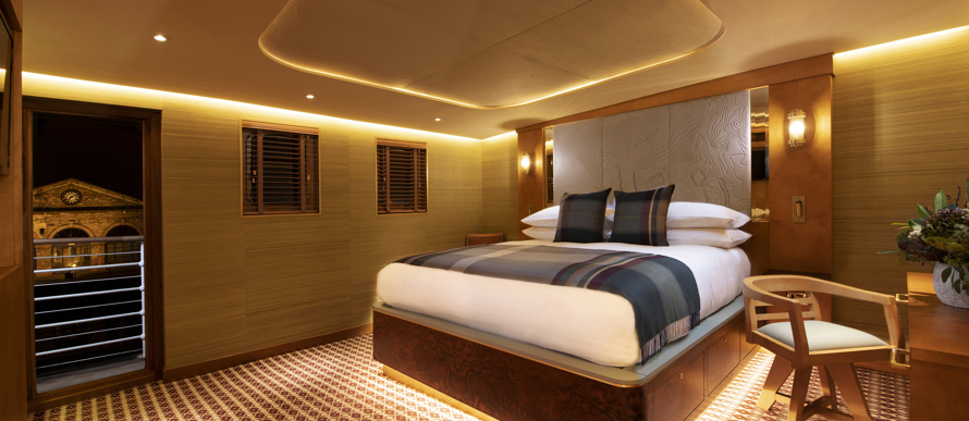 Super king size bed with under bed lighting in Fingal's Hyskeir luxury cabin room at 5 star hotel Edinburgh