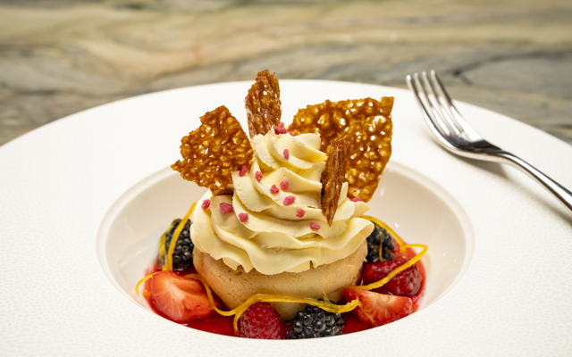 A dessert from Fingal's dinner menu of passion fruit & Drambuie savarin, macerated Perthshire berries, and Chantilly cream. 
