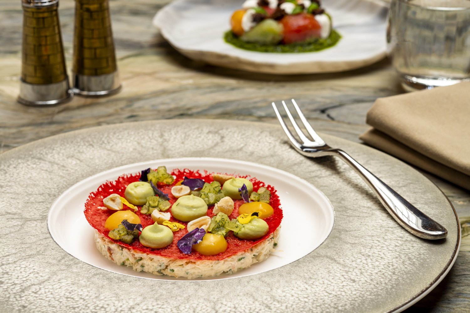 A crab starter dish including Eyemouth crab, hazelnut, dill apple, mandarin, avocado. 