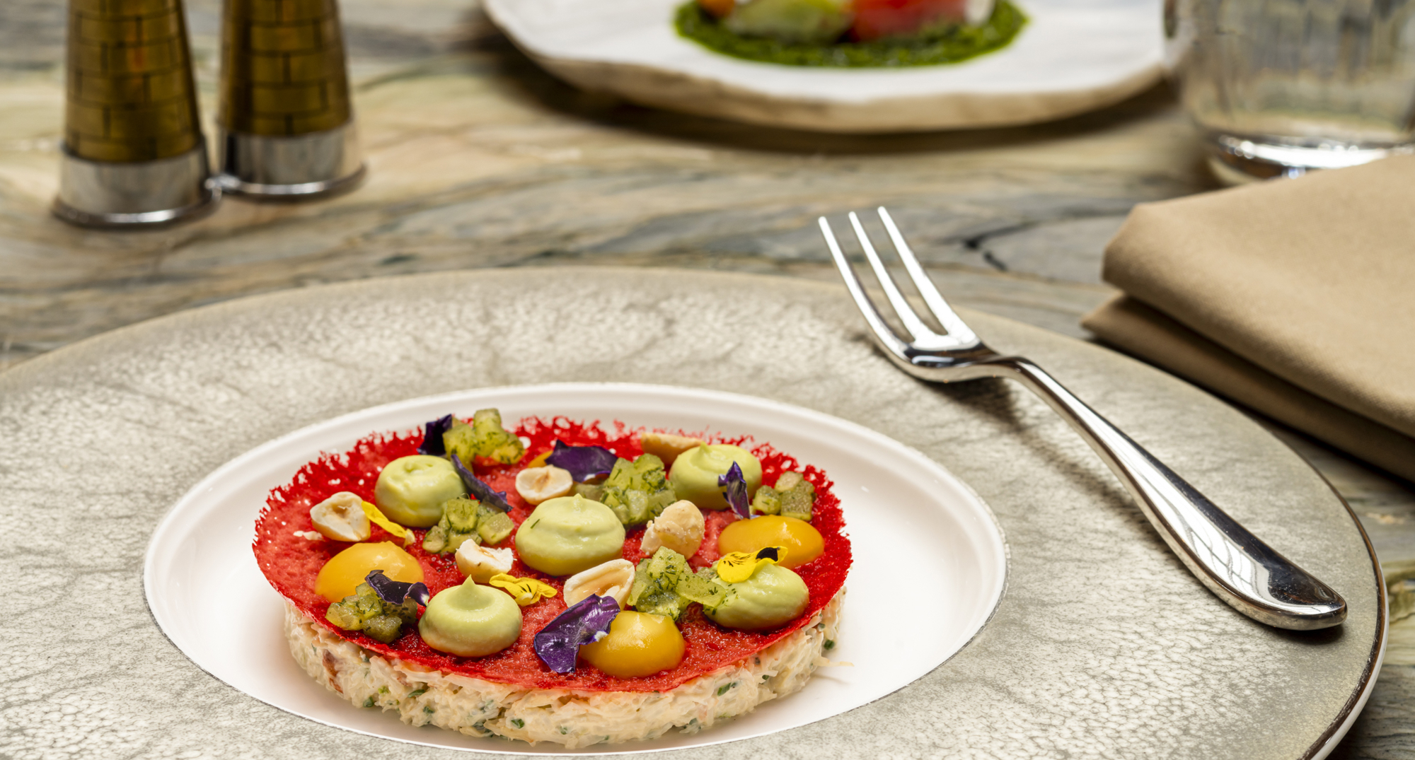 A crab starter dish including Eyemouth crab, hazelnut, dill apple, mandarin, avocado.