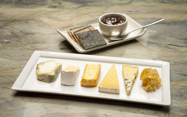Scottish artisan cheese selection, apple & ale chutney, grapes, honeycomb, sourdough crackers. 