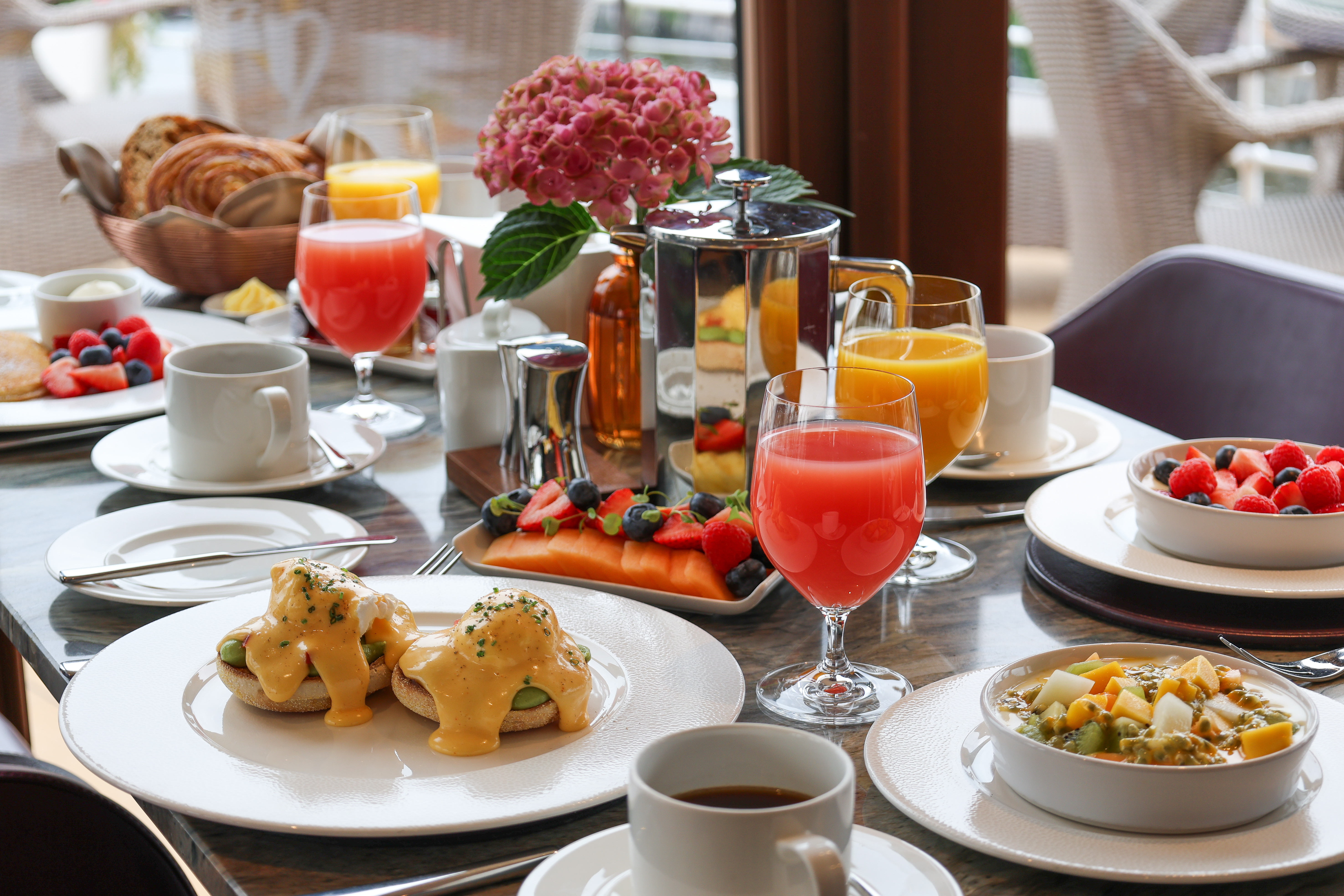 Breakfast table with colourful foods.
