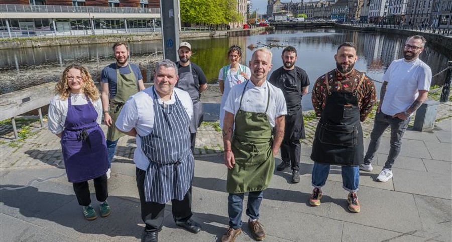 Chefs standing along the Water Of Leith 