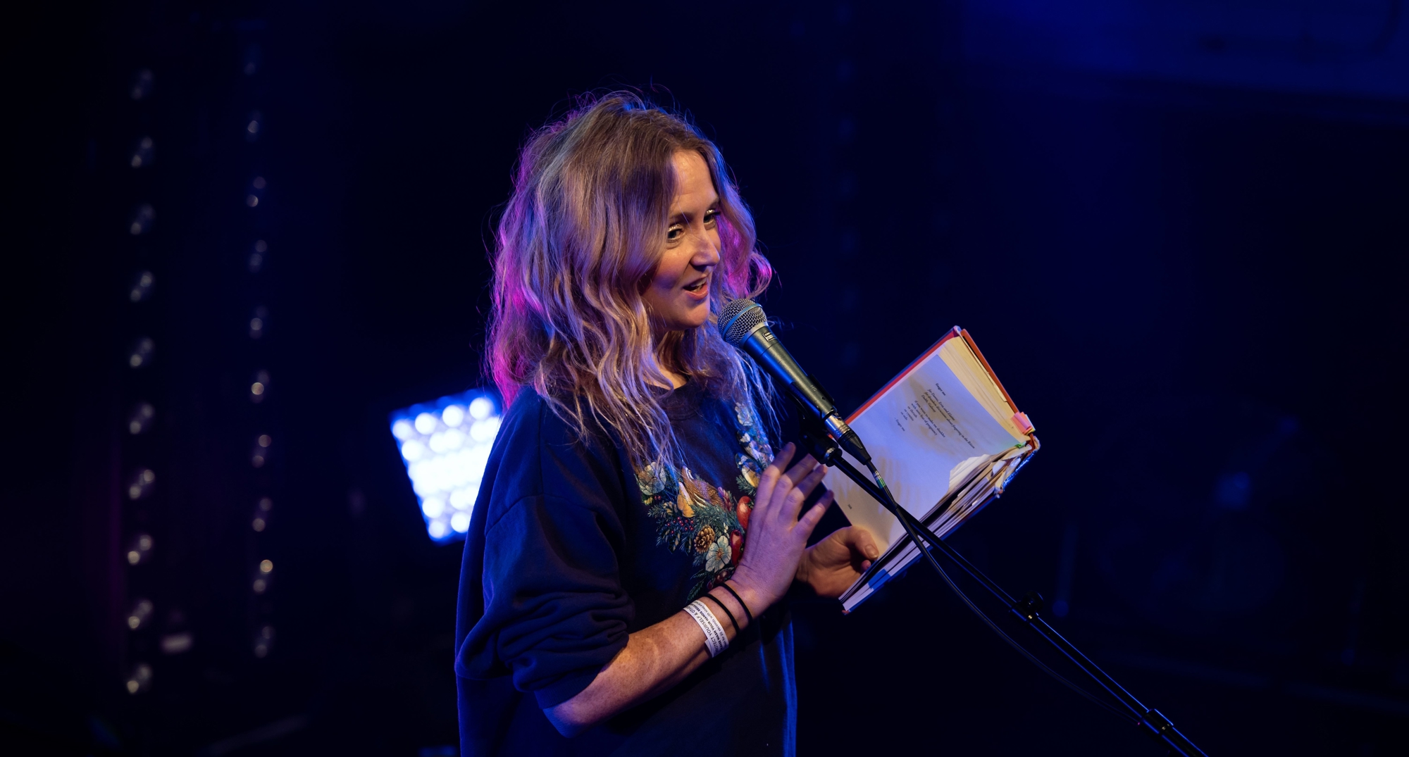 Woman speaking on stage