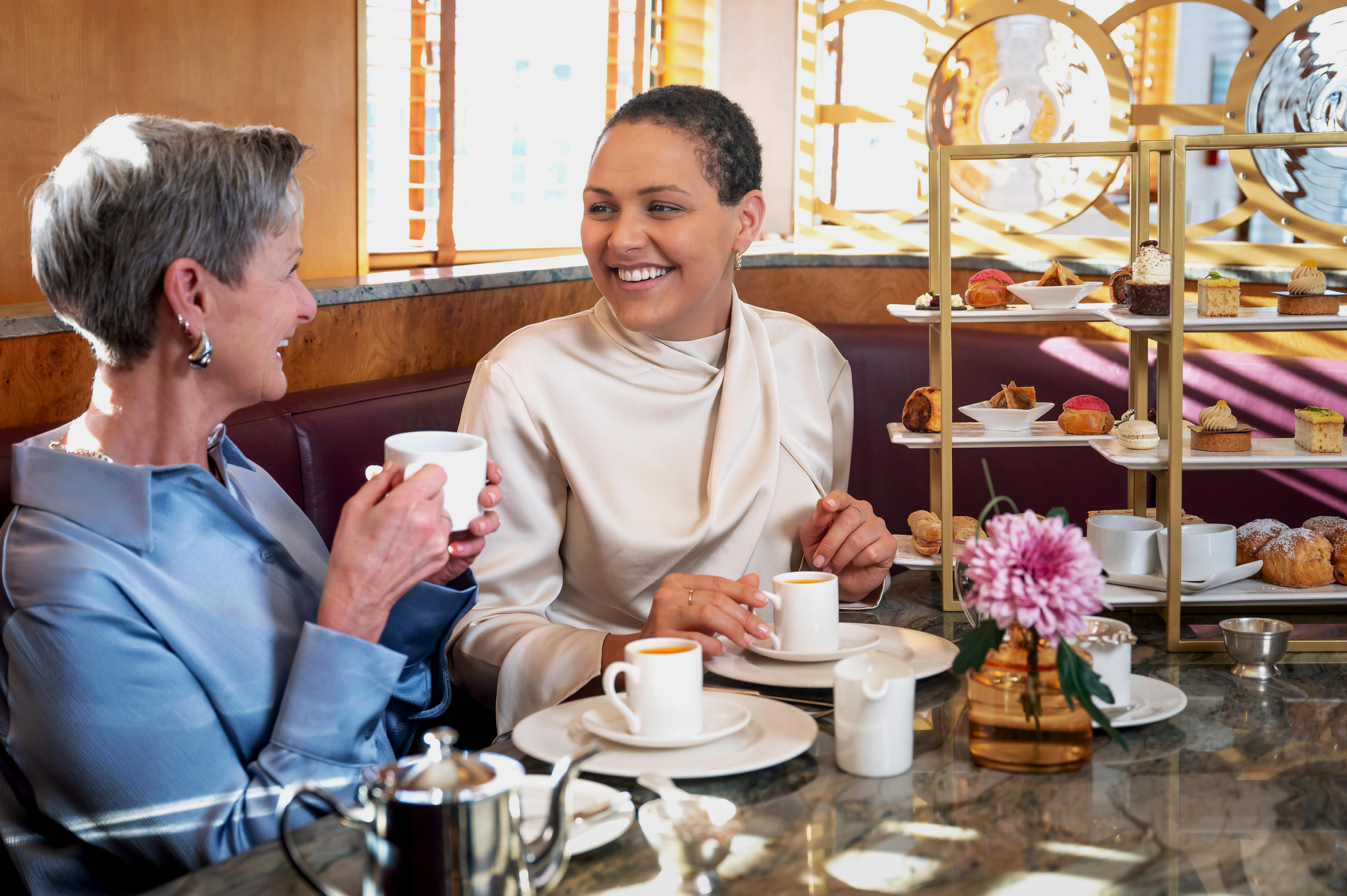 Mom and daughter enjoying afternoon tea