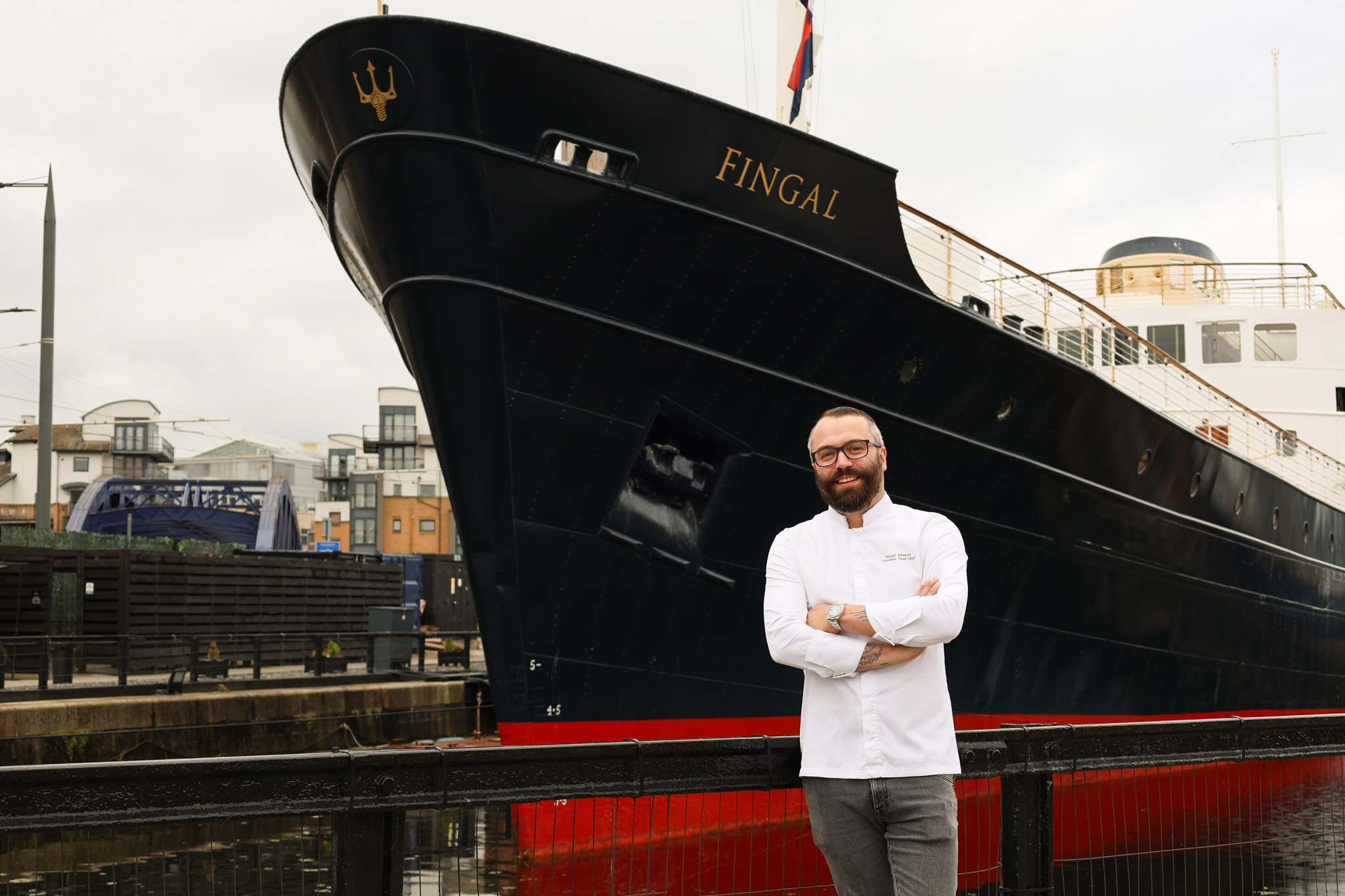 Chef infront of a ship