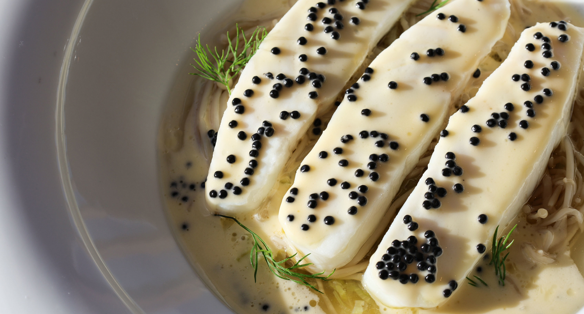 Loch Fyne halibut aiguillette, enoki & leek broth, Arenkha caviar beurre blanc