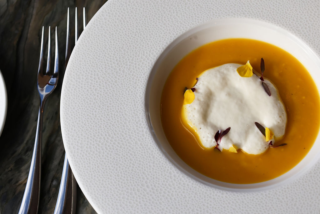 Bowl of soup on a dining table