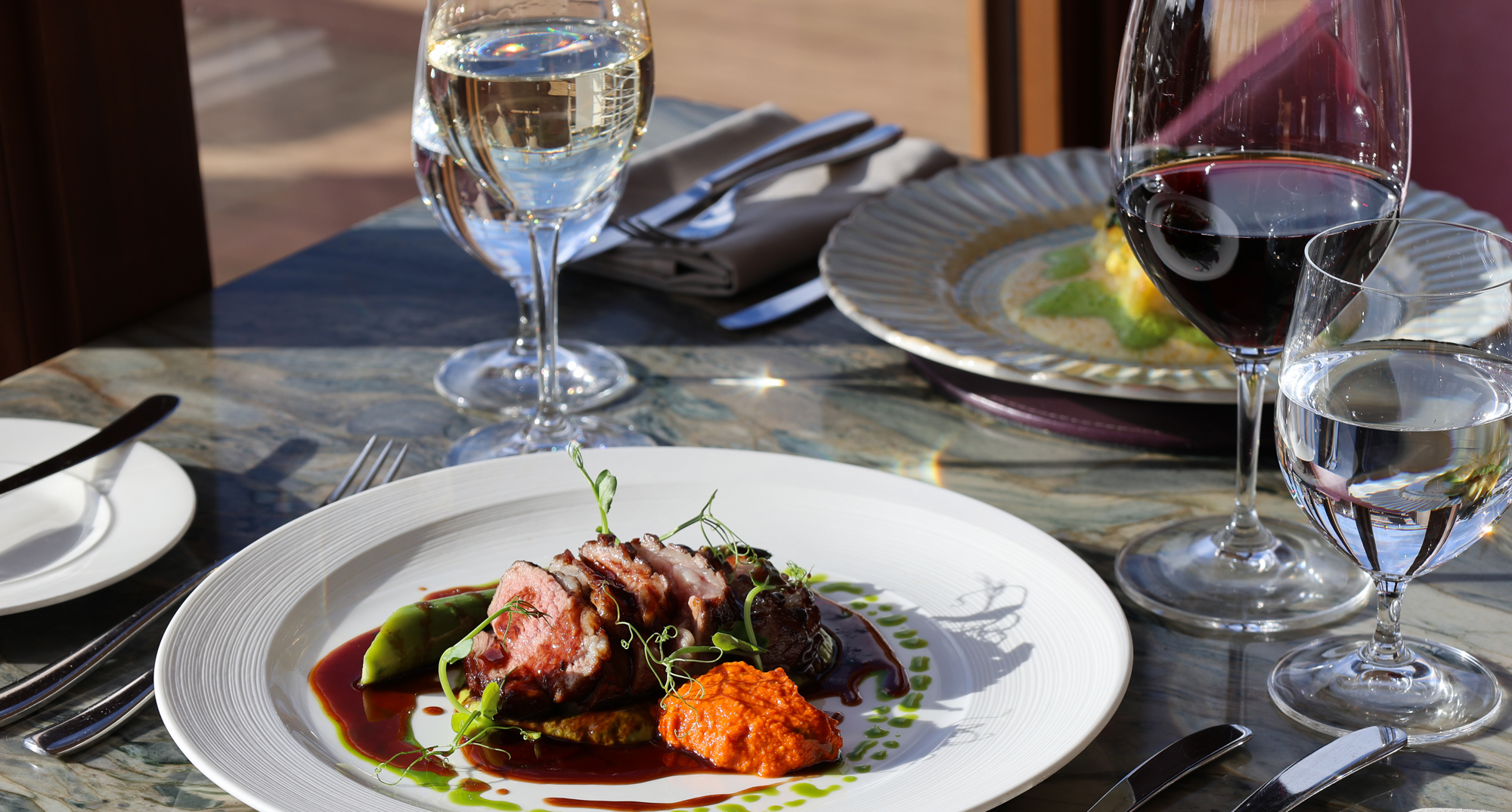 Tweed Valley lamb rump, courgette & basil purée,  romesco, asparagus & lamb jus