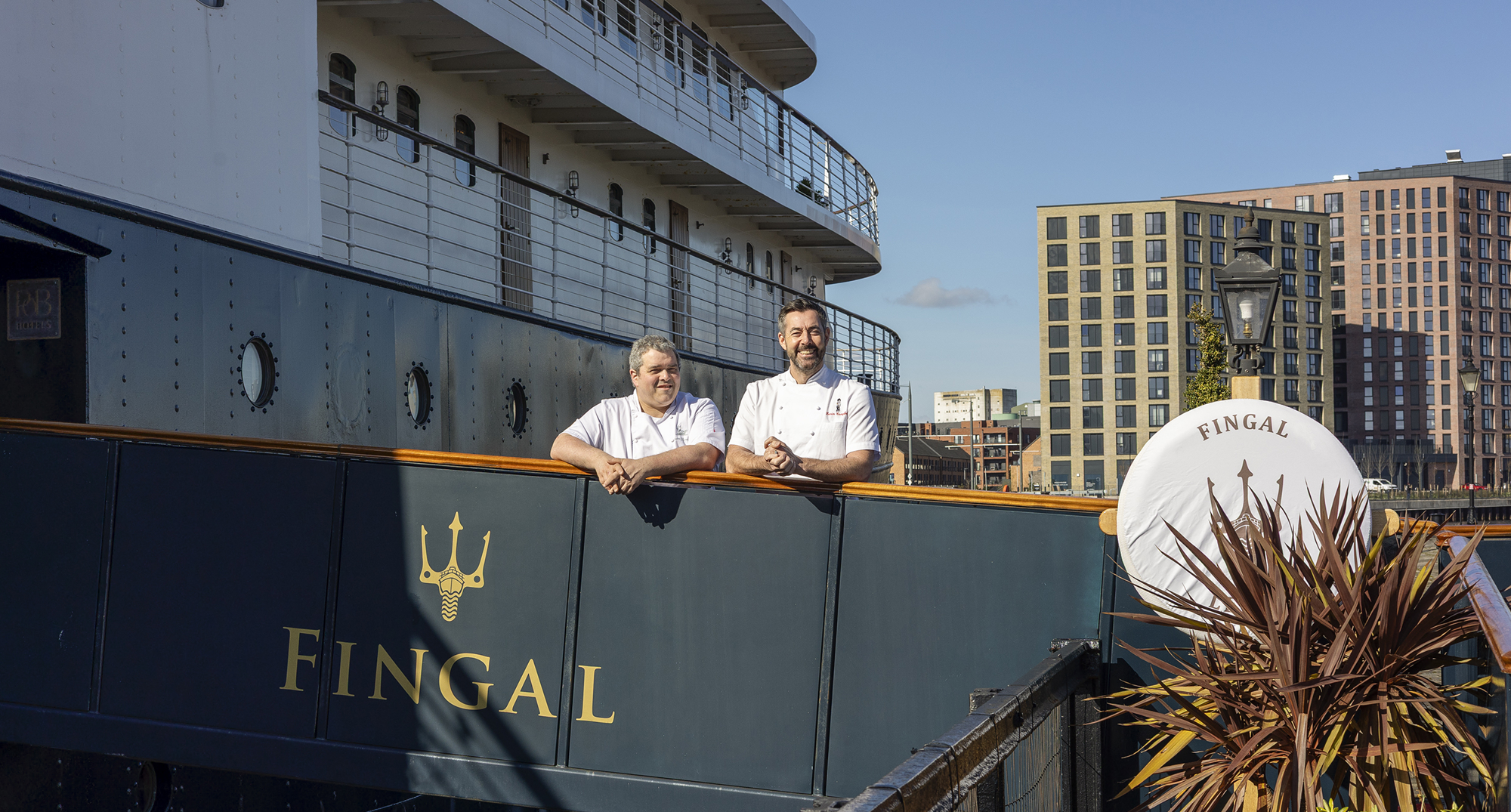 Two chefs on a brow of a ship