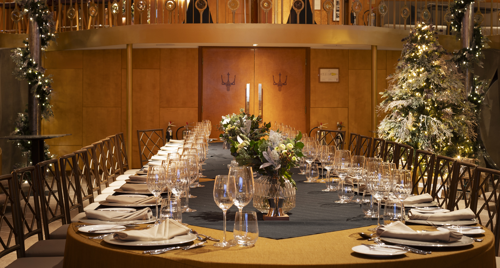 Christmas dining room table in large private dining room, decorated for Christmas in the ballroom aboard Fingal luxury Edinburgh Restaurant & hotel.