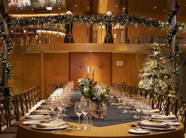 Christmas dining room table in large private dining room, decorated for Christmas in the ballroom aboard Fingal luxury Edinburgh Restaurant & hotel.
